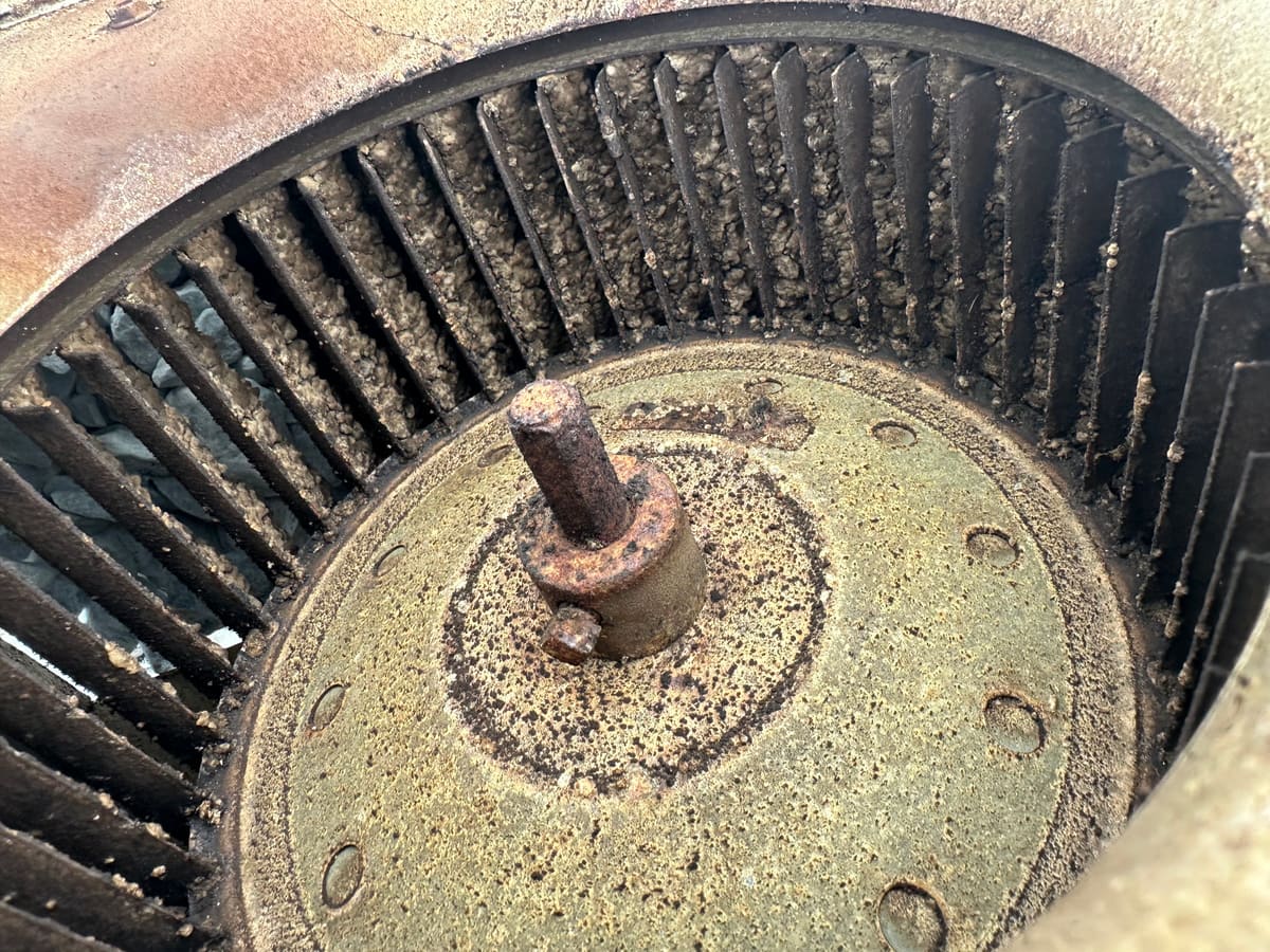 Blower wheel caked with dirt before cleaning