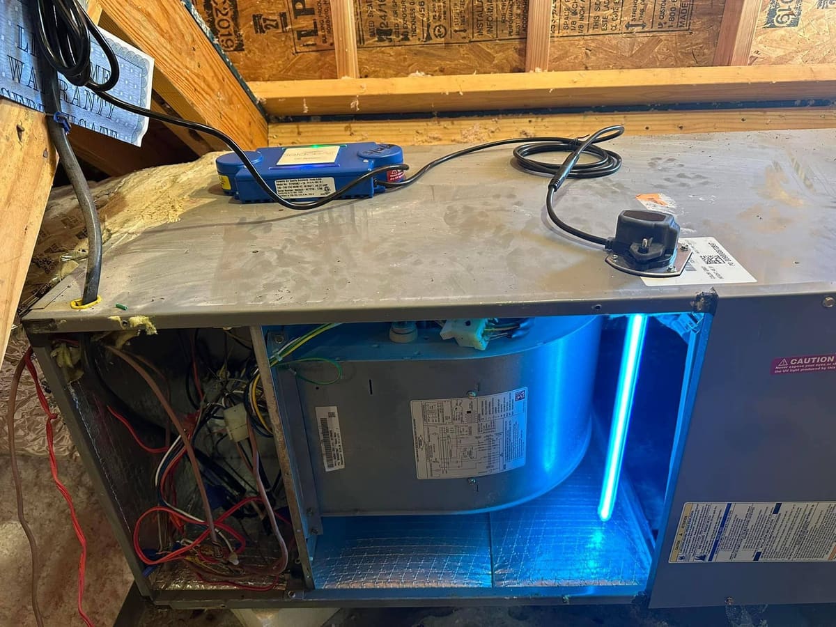 UV light installed inside an air handler cabinet in an attic